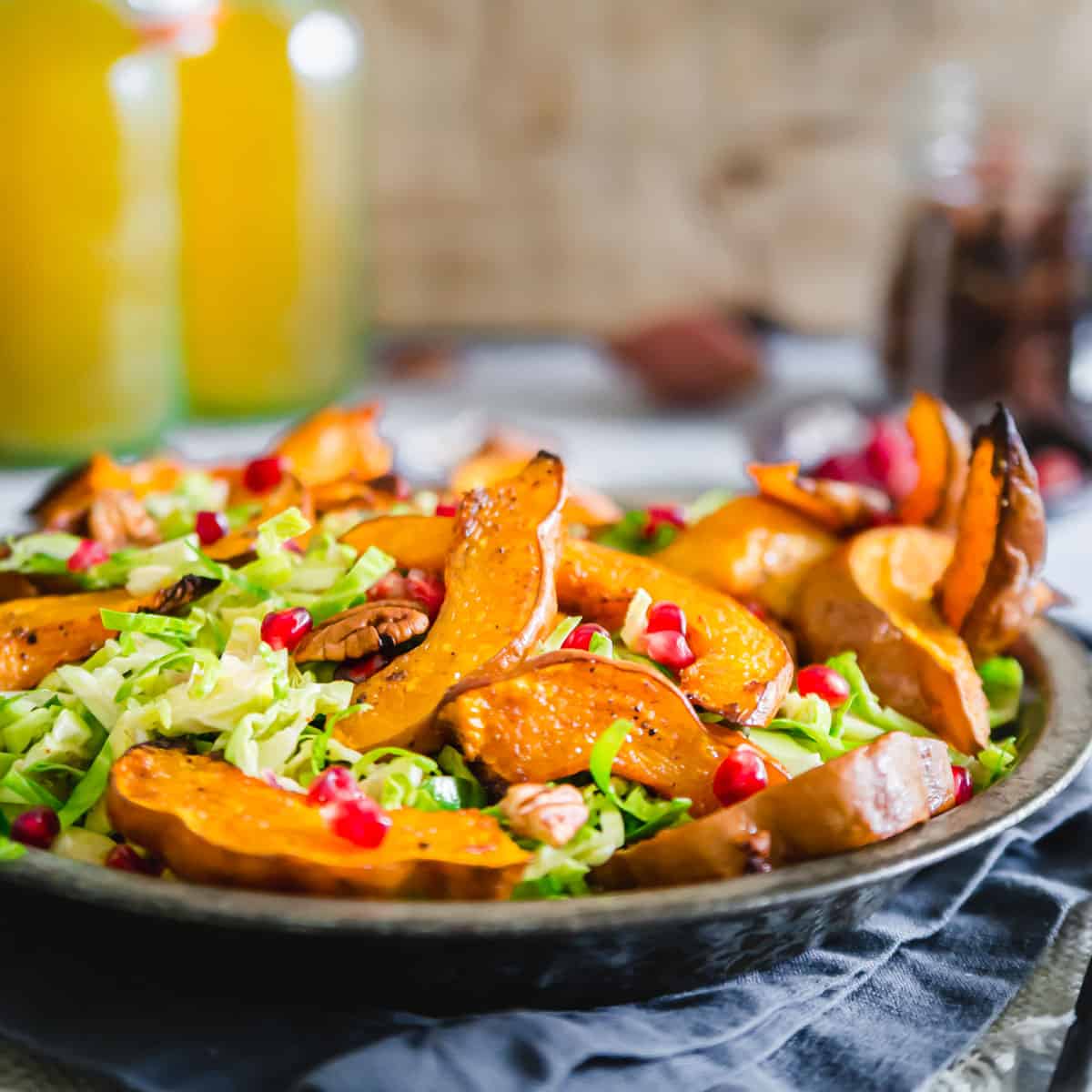 roasted koginut squash with shredded brussels sprouts and pomegranates