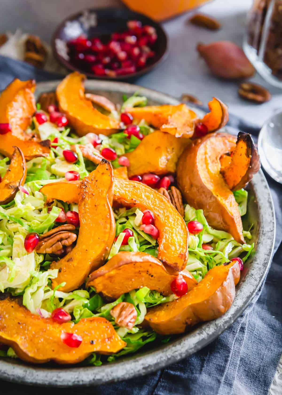 Roasted koginut squash salad with shaved brussels sprouts and pomegranates.