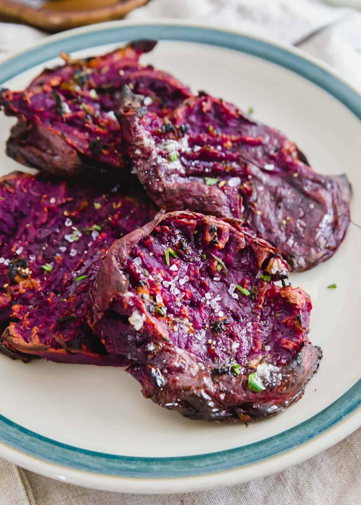 This purple sweet potato recipe uses Stokes sweet potatoes that are smashed, drizzled with melted butter and herbs then roasted until super crispy.