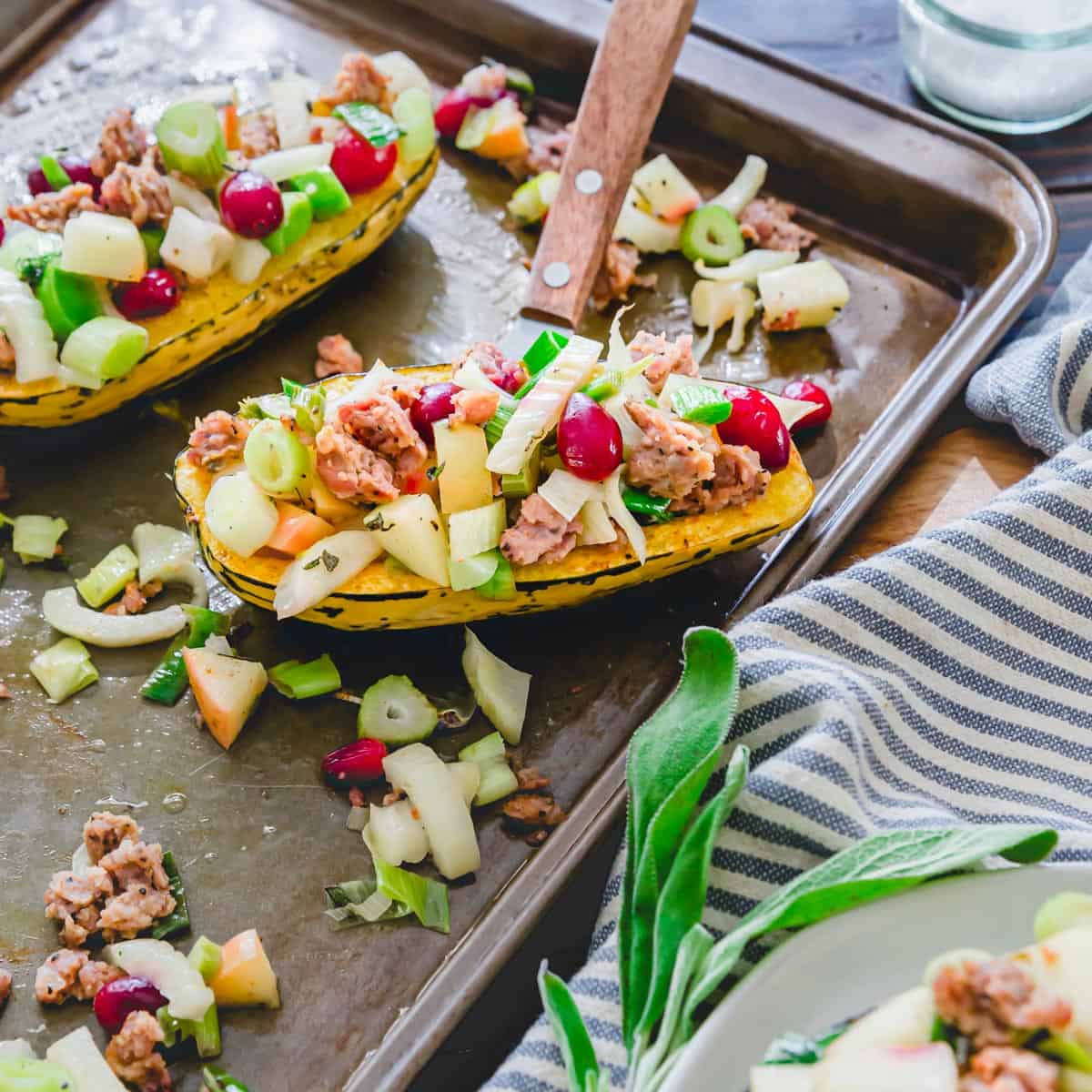 Roasted stuffed delicata squash bursting with savory and sweet fall flavors that complement the tender, slightly sweet squash perfectly.