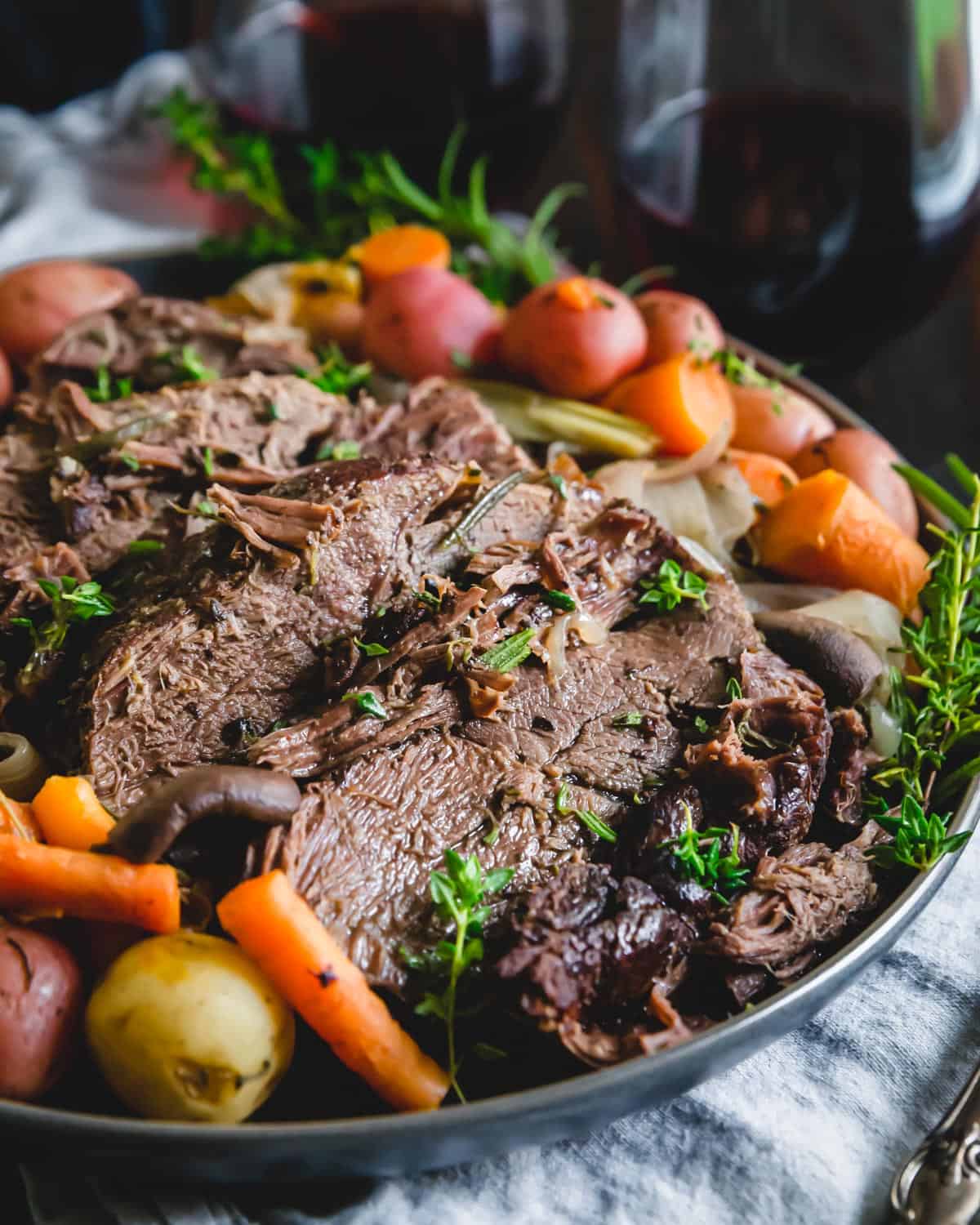 Red wine balsamic venison roast is a simple served with carrots, onions, mushrooms and potatoes and cooked in the Instant Pot until fork tender.