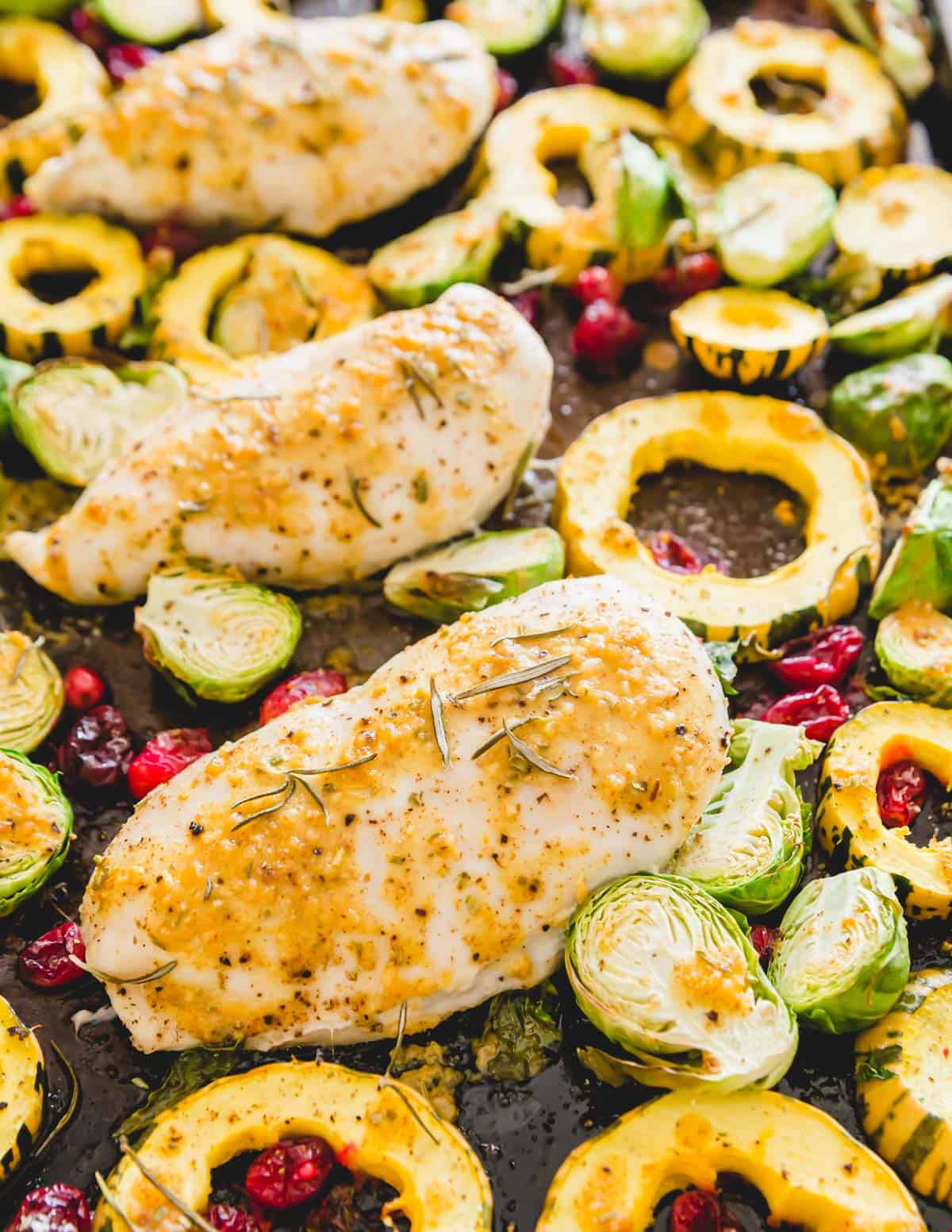 Sheet pan maple mustard rosemary chicken is an easy fall dinner with seasonal vegetables.