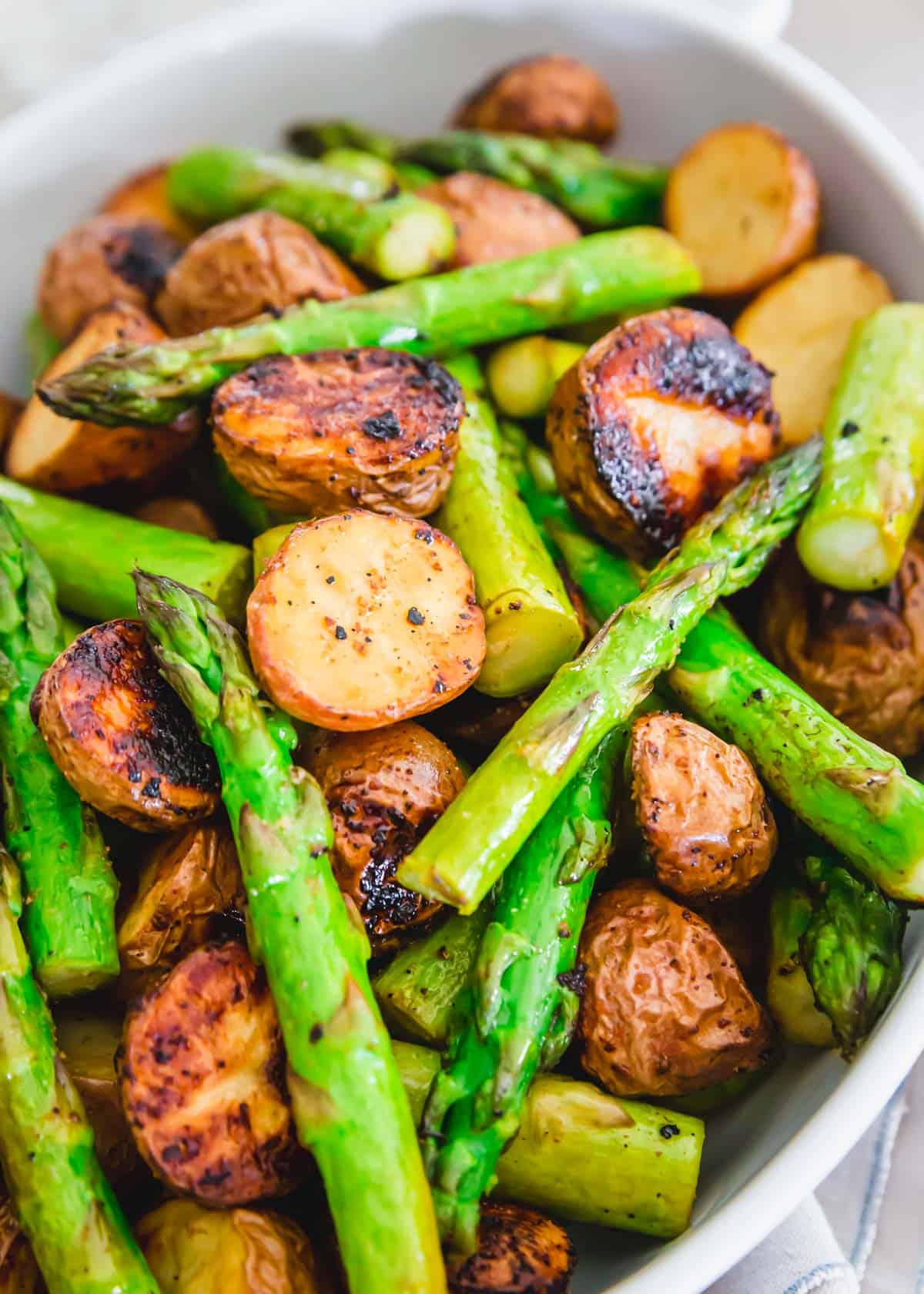 side dish of roasted potatoes and asparagus with garlic balsamic seasoning