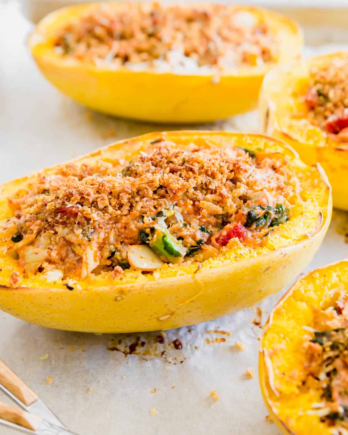 twice baked spaghetti squash stuffed with canned artichokes, chopped spinach, sun-dried tomatoes, cheese and breadcrumbs