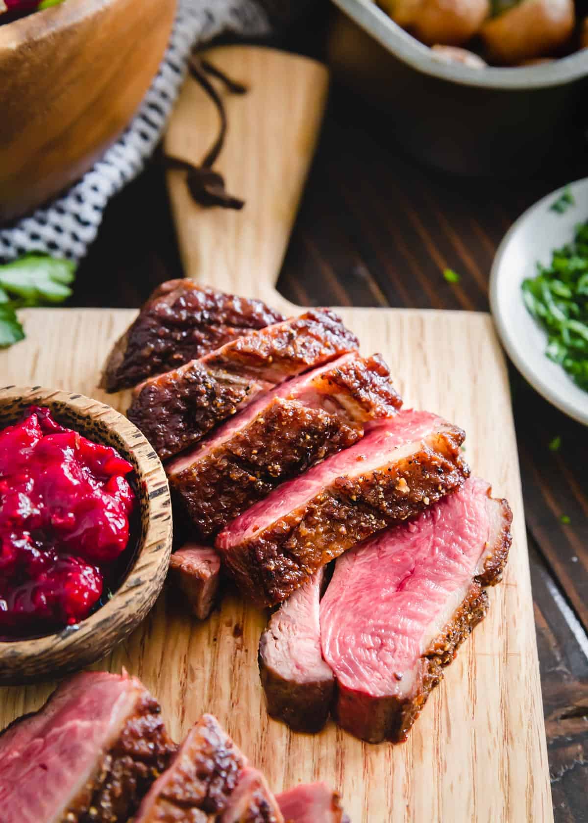 This duck breast recipe comes together so easily with just a few simple ingredients using a quick pan sear method on the stove top. Learn how to cook duck breast with this impressively elegant yet effortless recipe. Perfect for a special dinner at home or to serve a crowd!