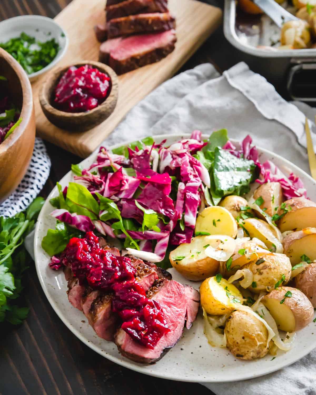 Perfectly pan seared duck breast recipe served with a 10 minute cranberry maple sauce.