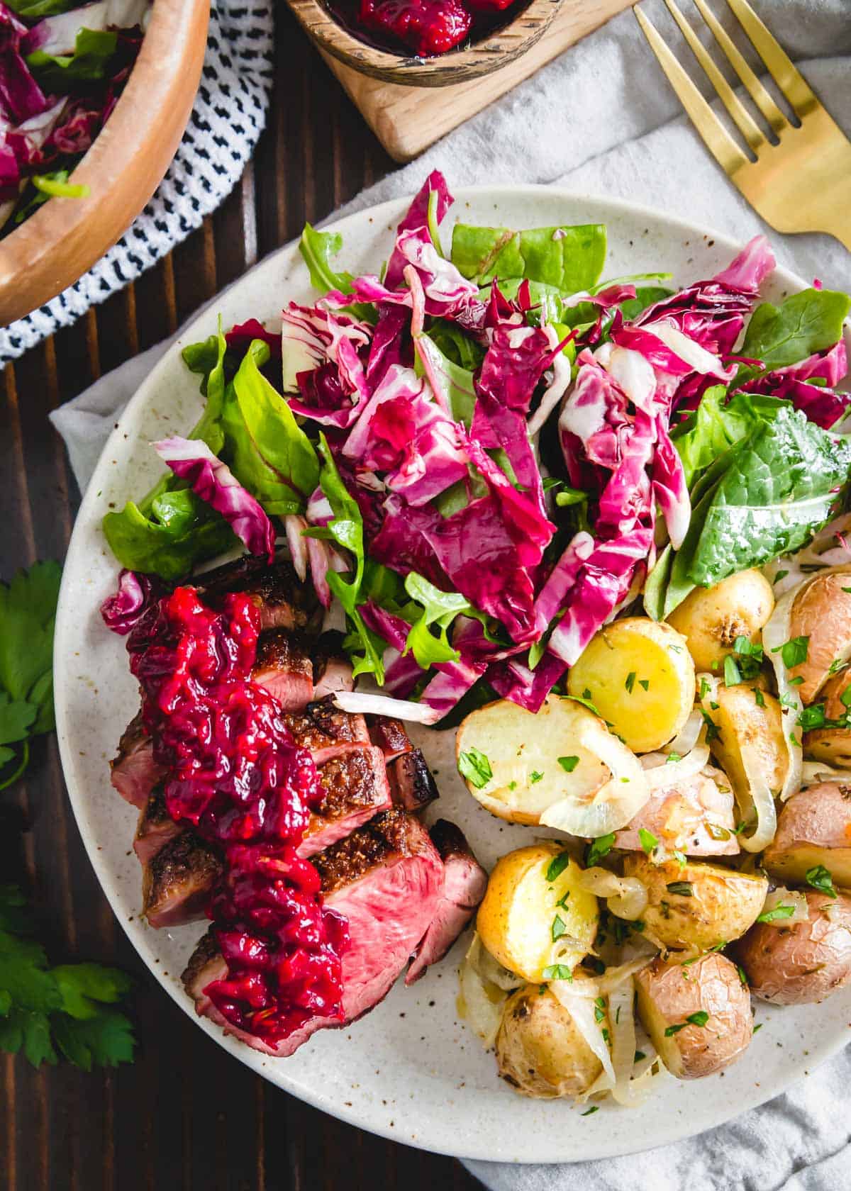 This easy to cook duck breast is served with a quick cranberry maple sauce and complementary sides such as a mixed green salad and roasted baby potatoes.