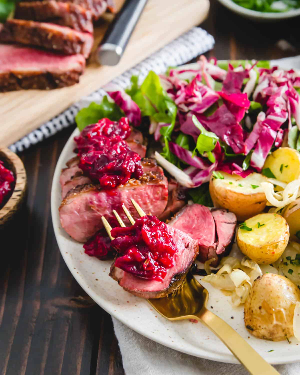 Crispy golden brown skin and a medium rare interior make this easy duck breast recipe impressively delicious served with a cranberry orange maple sauce.