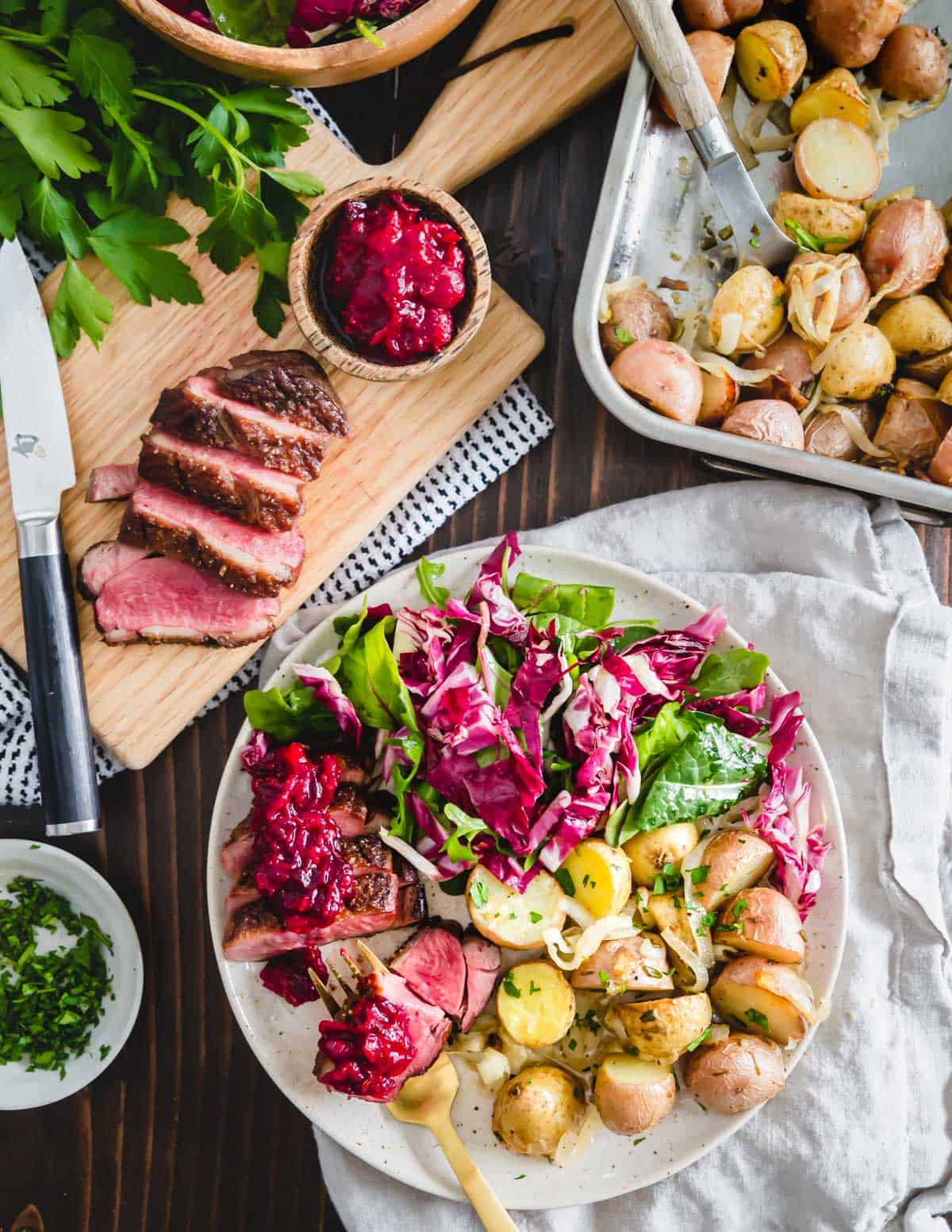 Learn how to easily cook duck breast at home with this simple pan seared duck breast recipe and quick cranberry maple sauce.