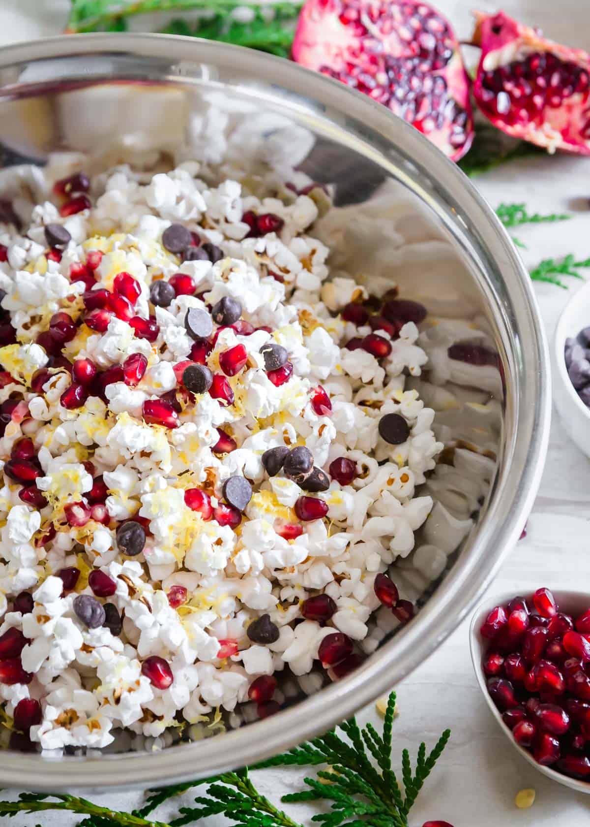 Easy stovetop popcorn combined with pomegranates, chocolate chips and lemon zest makes an easy and delicious winter snack mix!