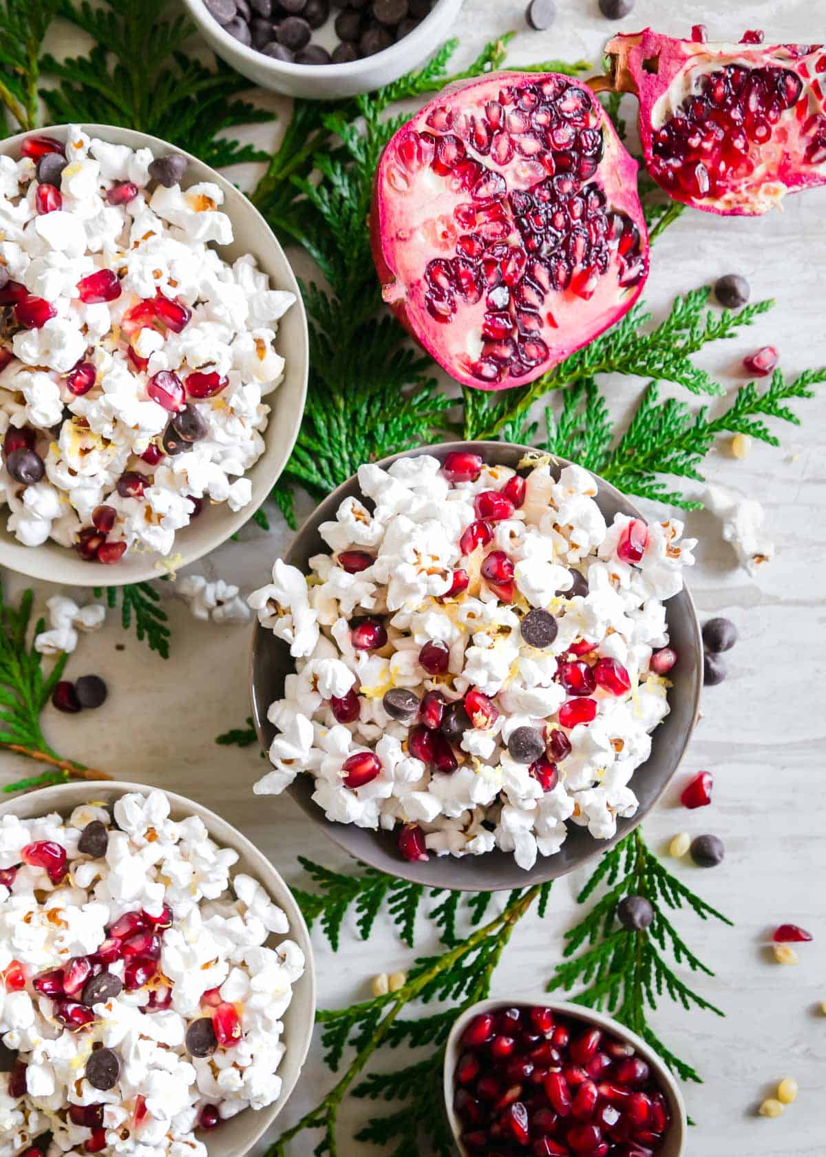 Enjoy this winter snack mix of popcorn, pomegranates, chocolate chips and lemon zest as a deliciously easy snack or dessert this season!