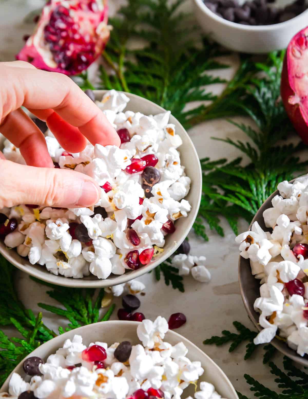 Give your popcorn snack a nutritious boost with some fresh pomegranate arils and lemon zest and a handful of chocolate chips for a bit of decadence!