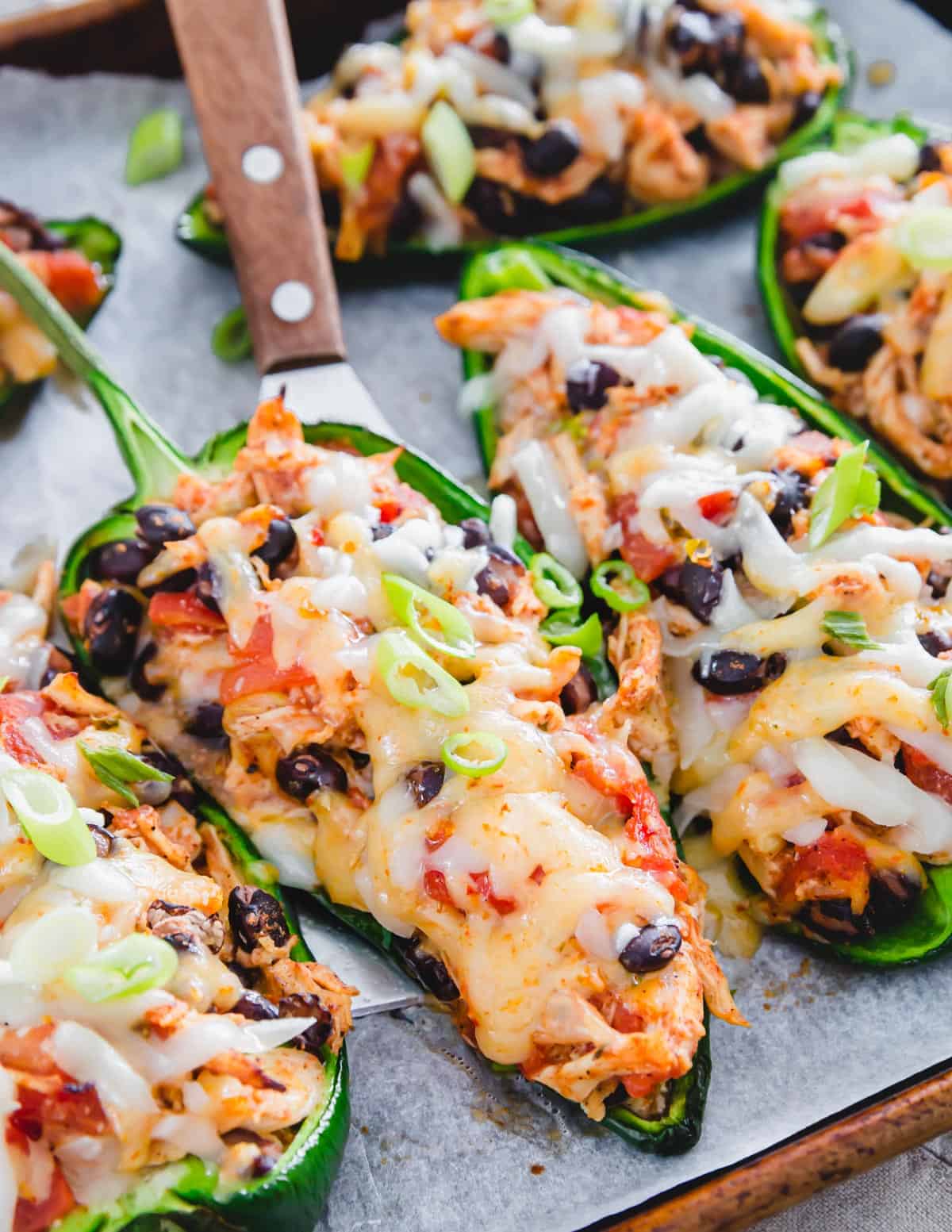 These easy chicken stuffed poblano peppers are packed with melted cheese, black beans and Mexican spices. 
