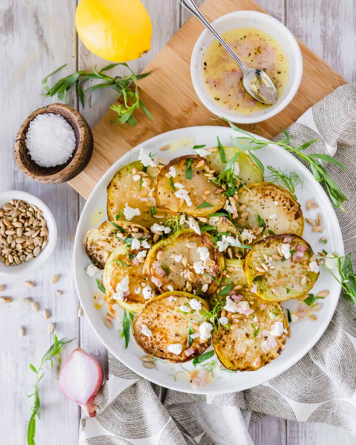 Tender oven roasted kohlrabi is served with a deliciously tangy lemon shallot vinaigrette.