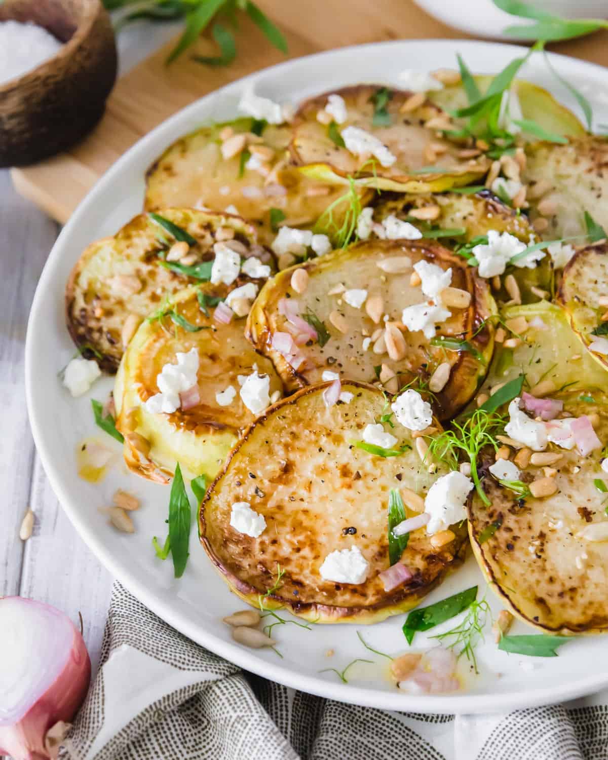 This easy oven roasted kohlrabi recipe transforms the unique vegetable with a lemon vinaigrette, goat cheese and fresh tarragon. 