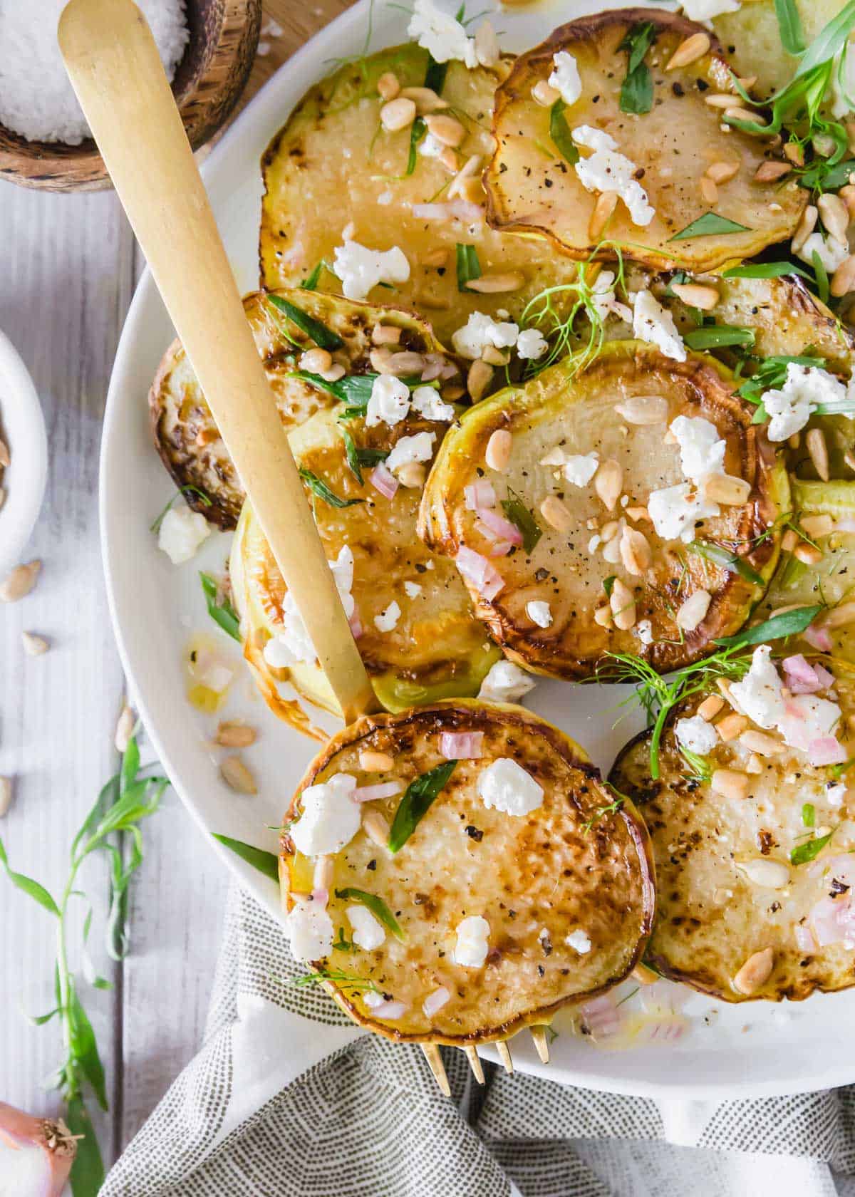 Learn how to cook kohlrabi with this simple roasting method. A lemon vinaigrette, goat cheese, tarragon and crunchy sunflower seeds transform it into a delectable side dish!