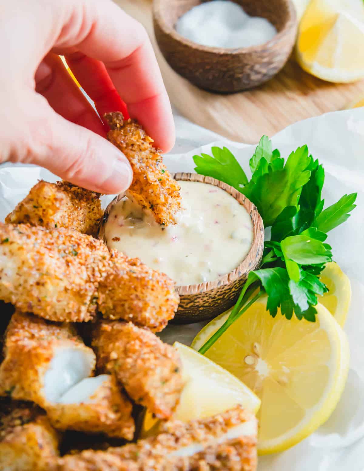 An easy spin on remoulade using dijon mustard, mayonnaise, red onion, pickles and capers becomes the perfect dipping sauce for air fryer fish sticks.