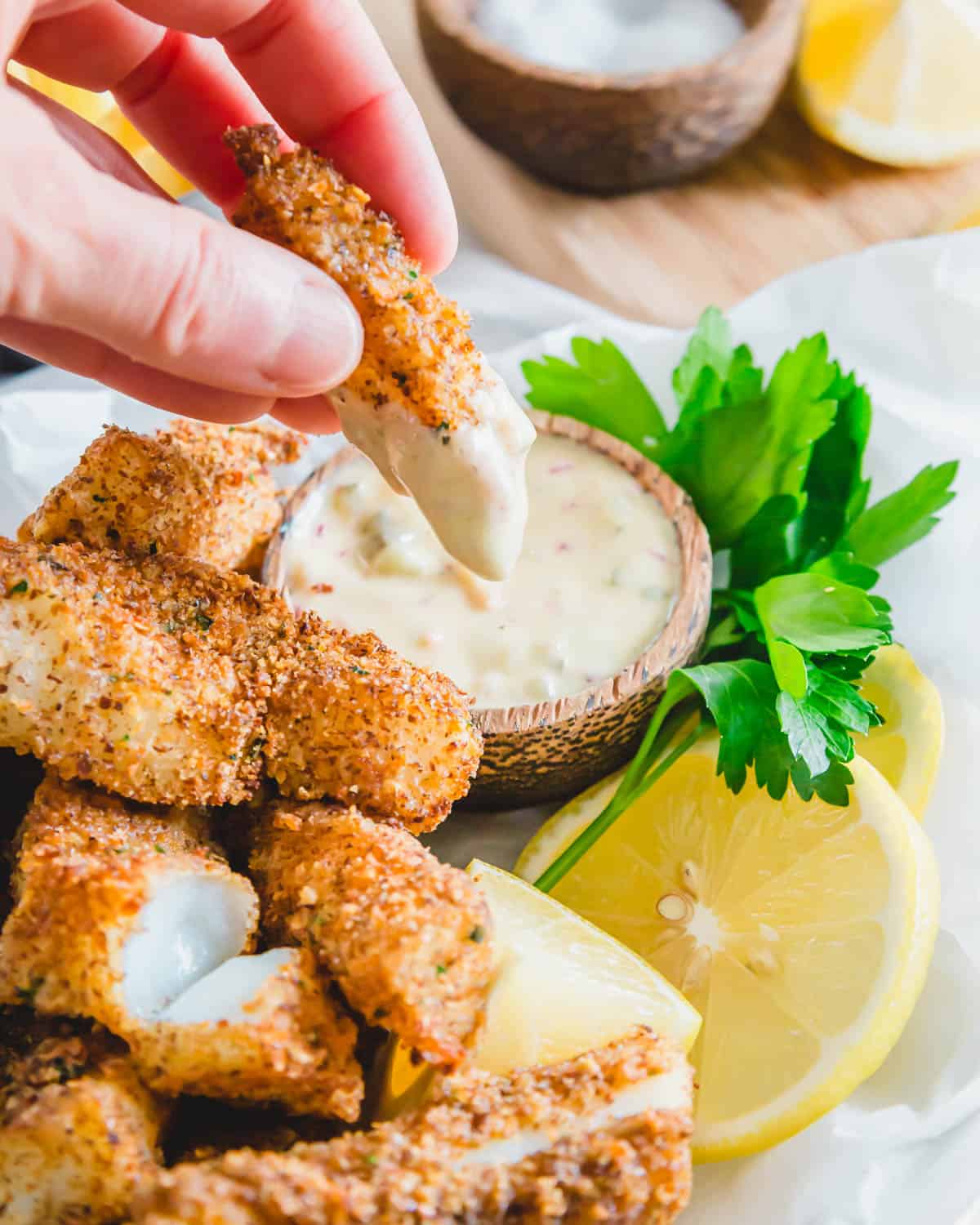 Enjoy these air fried cod fish sticks with a quick dijon remoulade dipping sauce.
