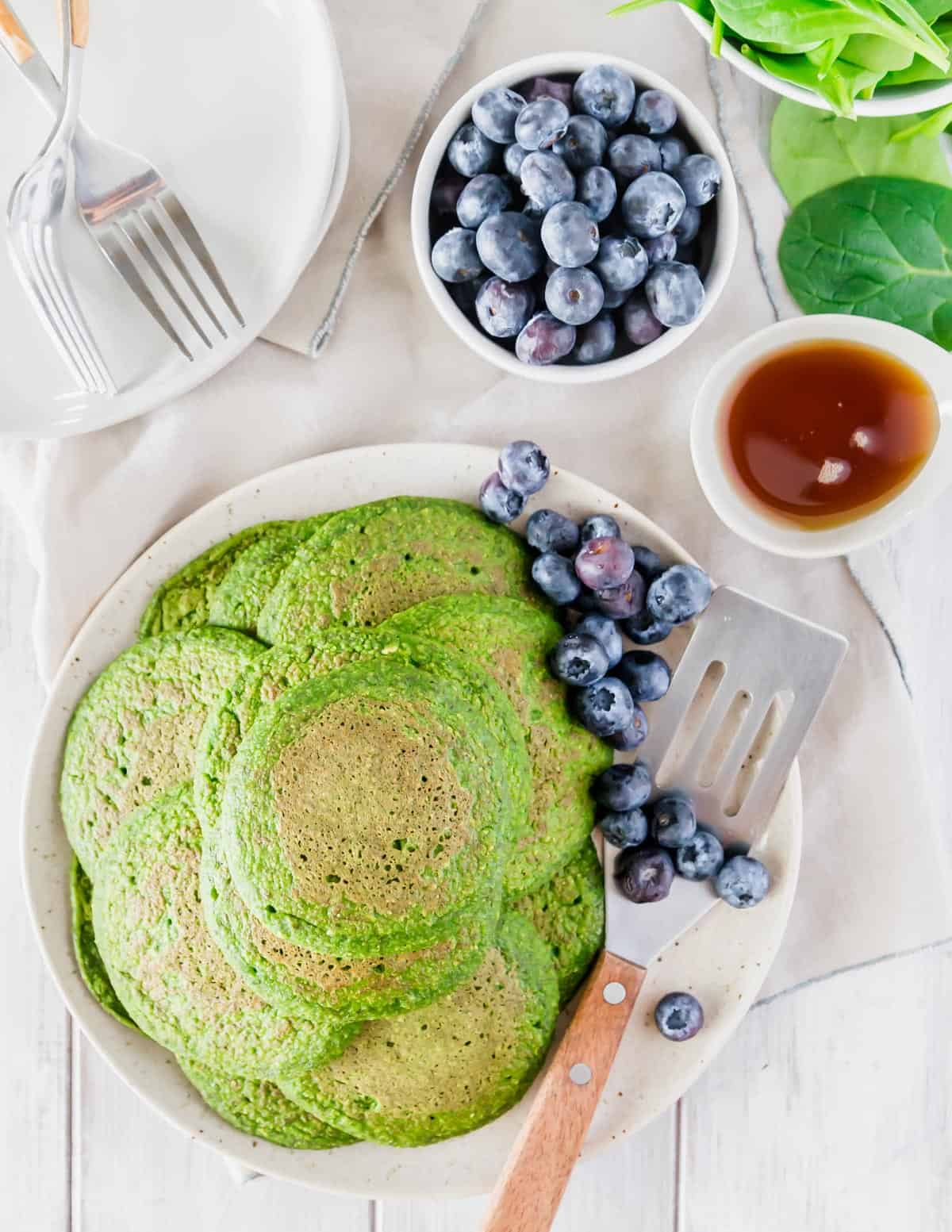 Gluten-free and vegan spinach pancakes are a fun festive breakfast for St. Patrick's Day.