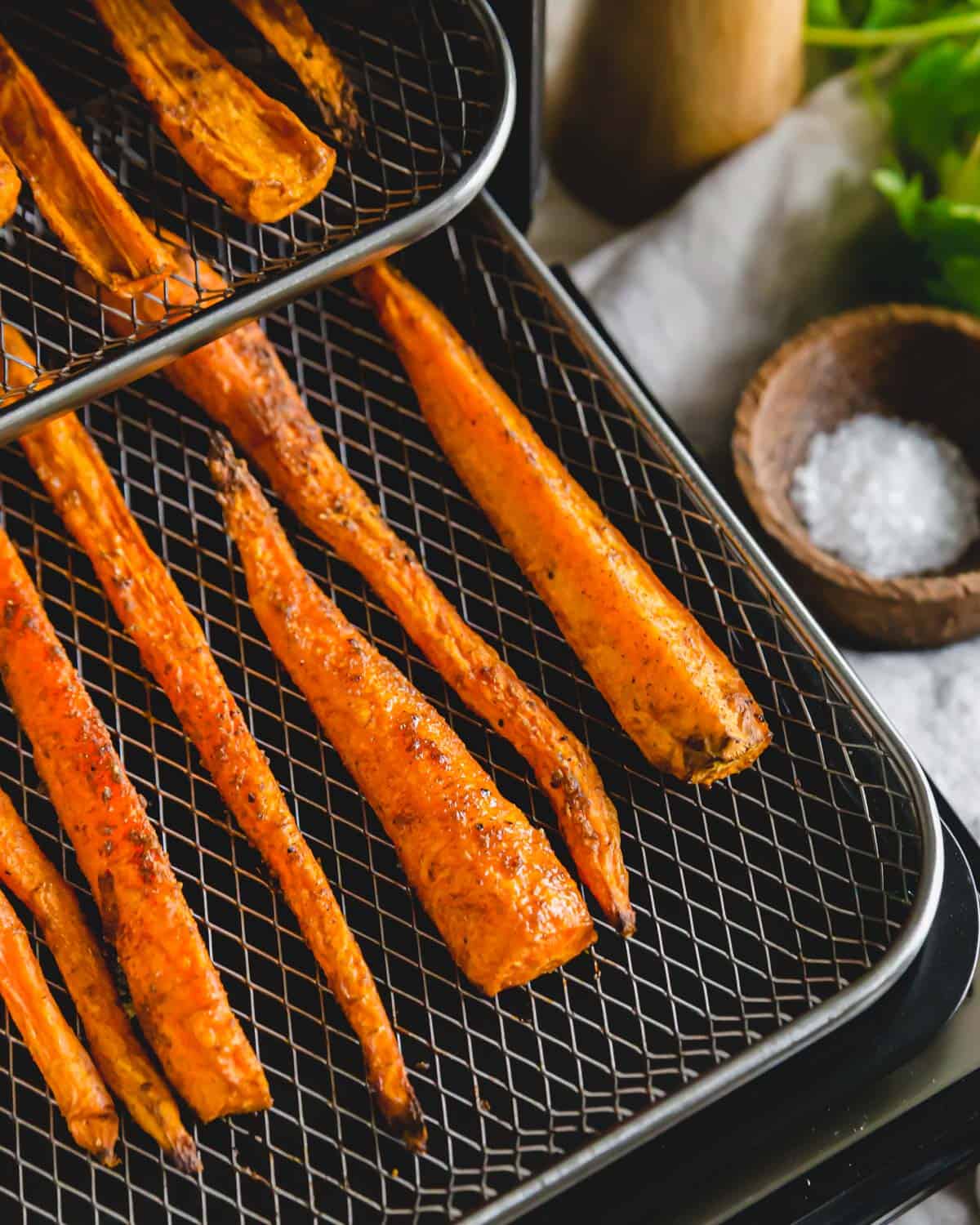 A handful of Moroccan inspired spices and olive oil is all it takes to transform these air fried carrots into a delicious side dish.