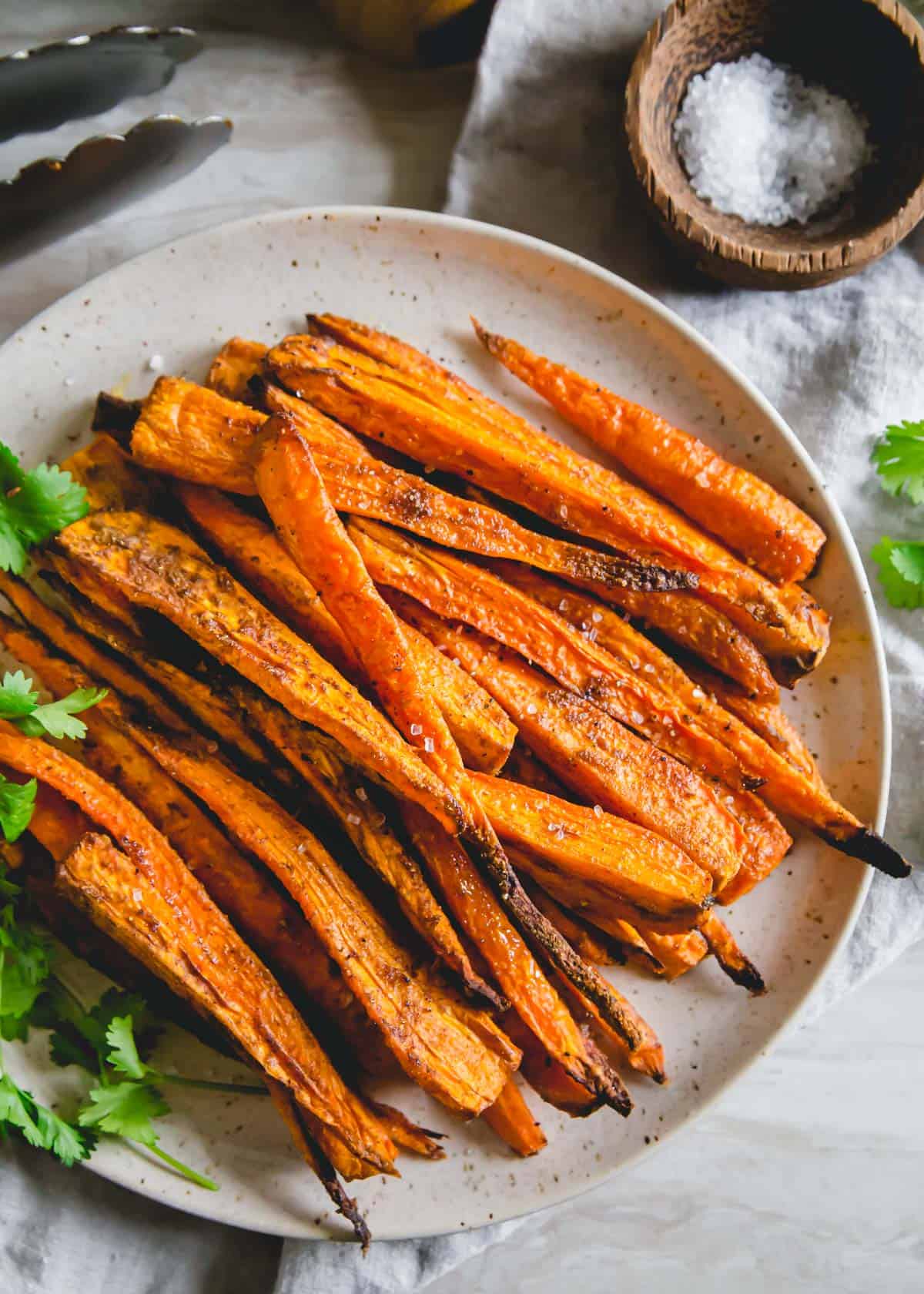 Tender savory spiced air fryer carrots with crispy edges is a simple side dish perfect for any meal made in just 20 minutes.