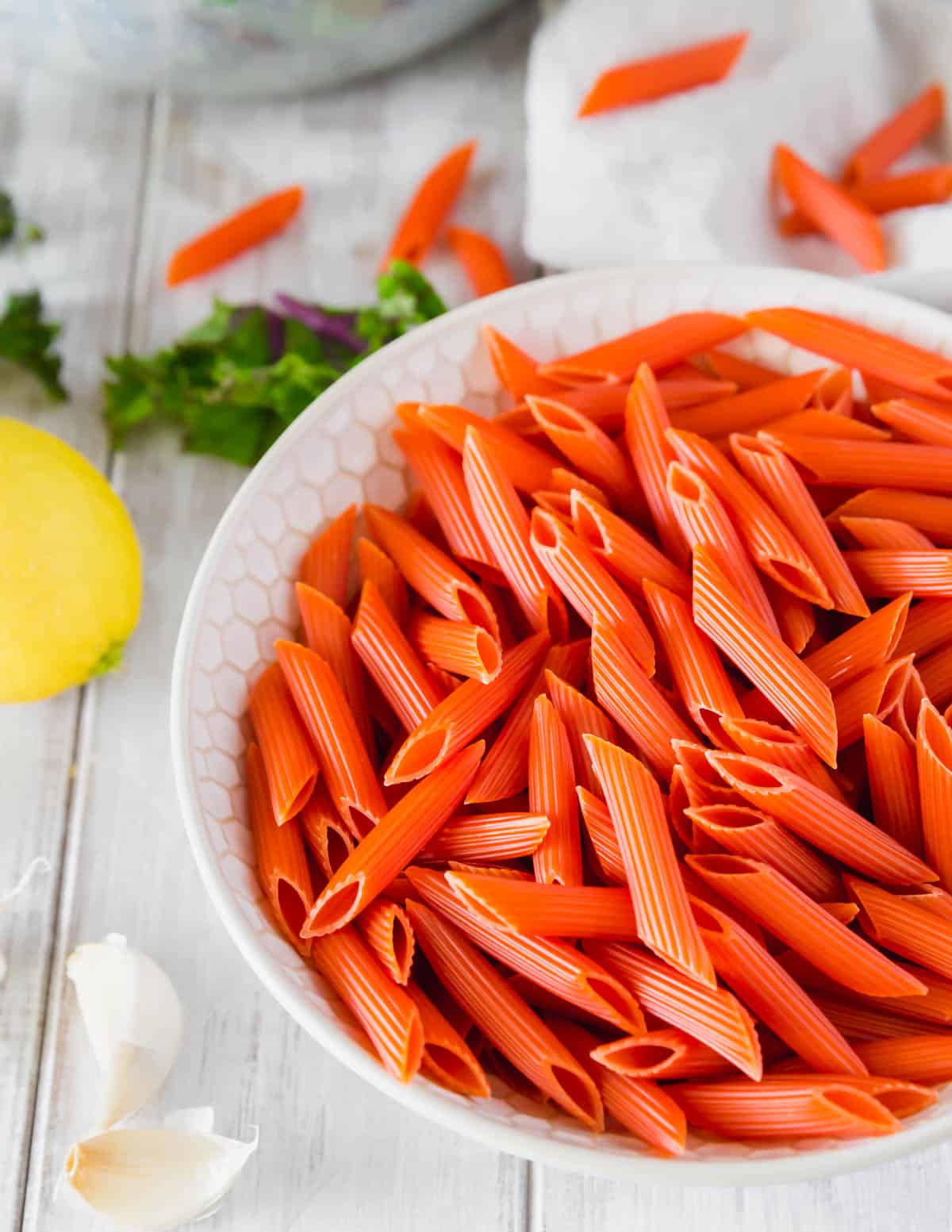 Uncooked red lentil penne pasta.