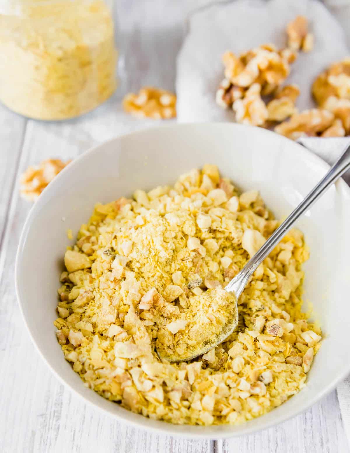 Chopped walnuts and nutritional yeast make a "cheesy" vegan topping for this red lentil pasta recipe.