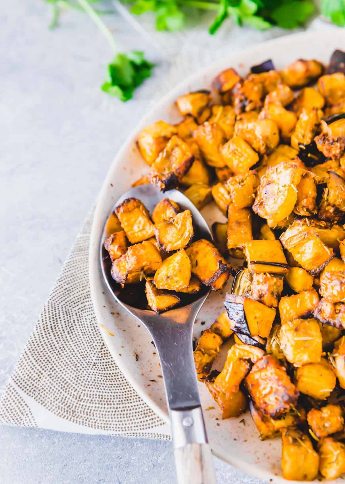 Close up shot of crispy eggplant cubes made in the air fryer with spices.