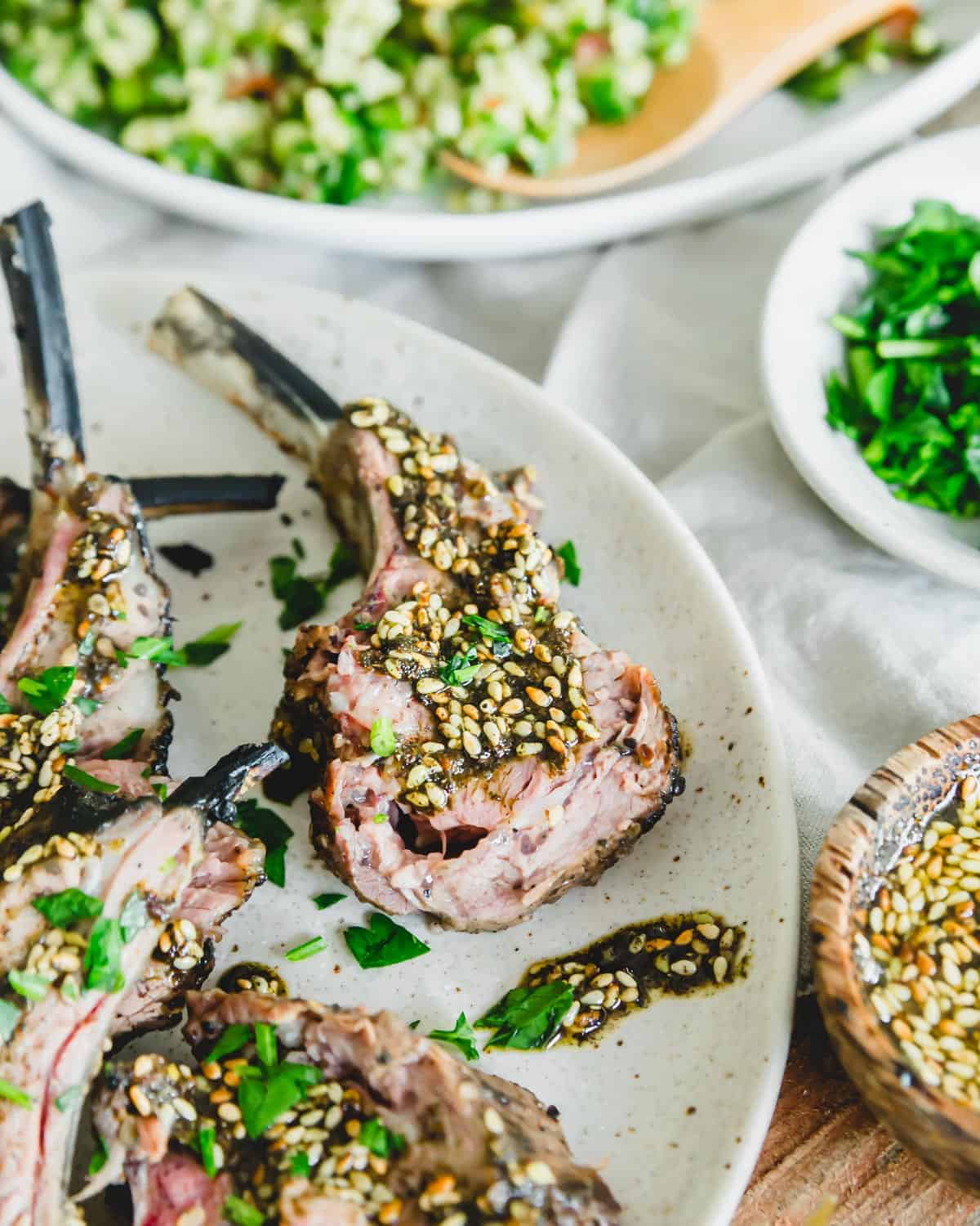 Grilled za'atar lamb chop on a plate.