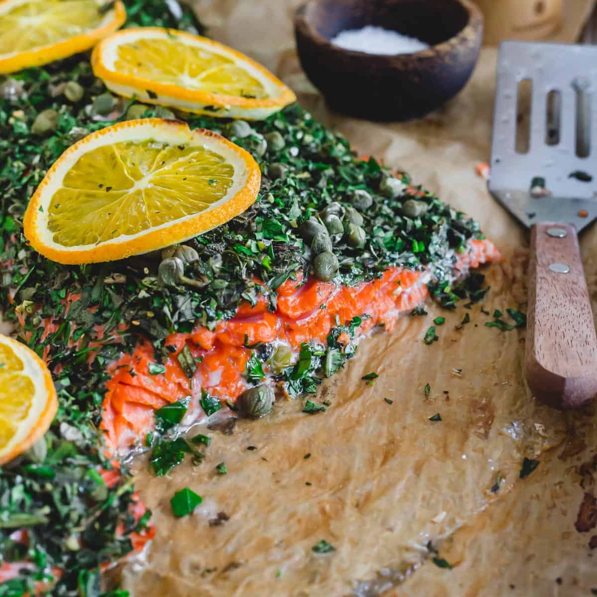 Herb coated baked sockeye salmon.