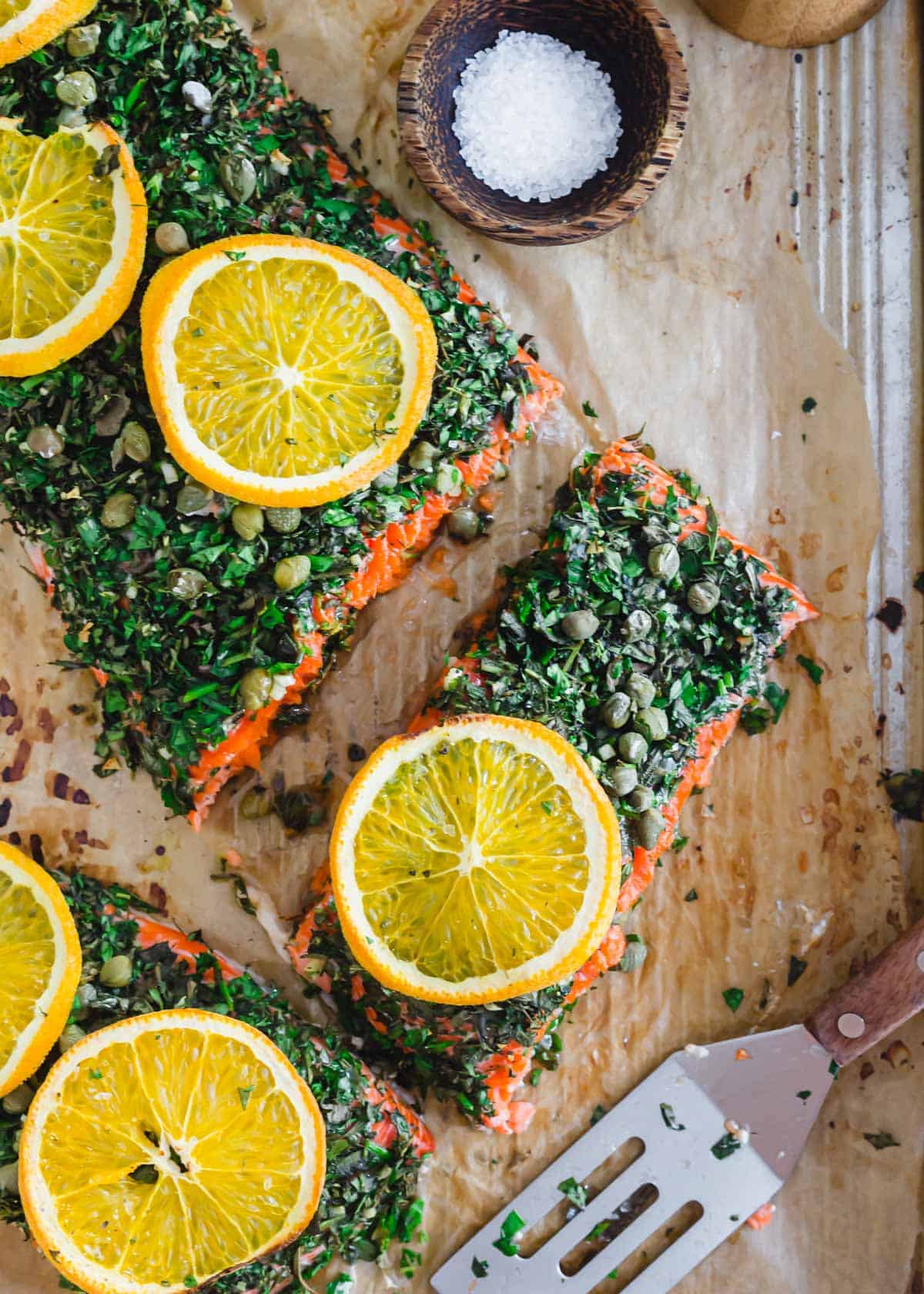 Sockeye salmon recipe using fresh herbs, garlic, capers and oranges.