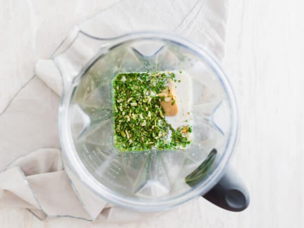 ingredients in blender to make vegan spinach artichoke dip