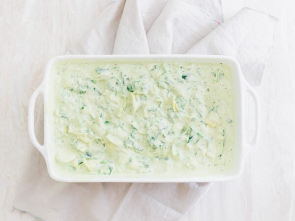 vegan spinach dip with artichokes before baking