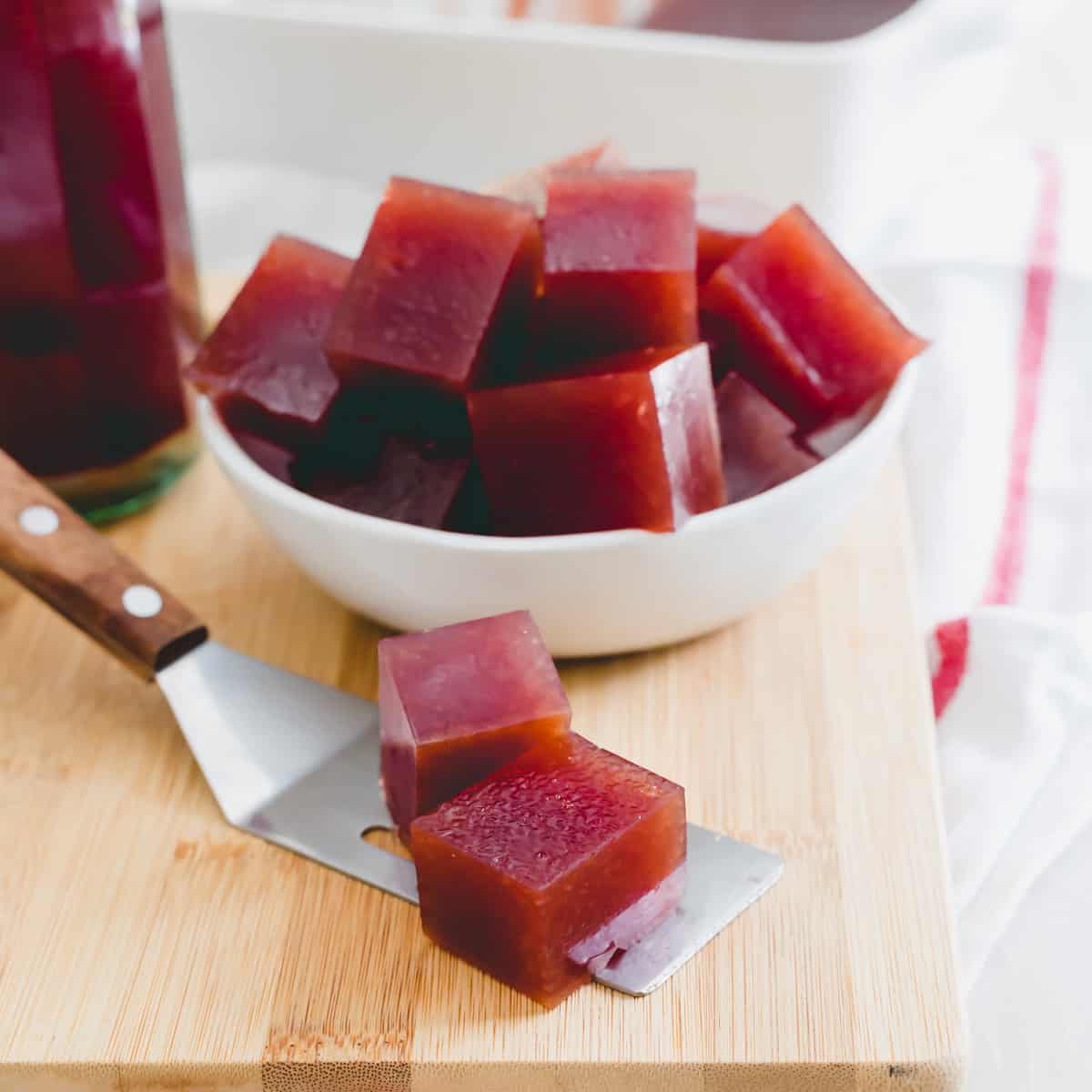 Easy gummies made with tart chery juice and cut into squares for nighttime snacking and a restful night's sleep.
