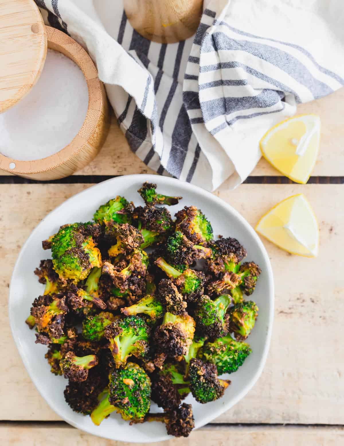 Seasoned frozen broccoli with turmeric, garlic powder, onion powder, salt and pepper roasted in the air fryer until crispy.