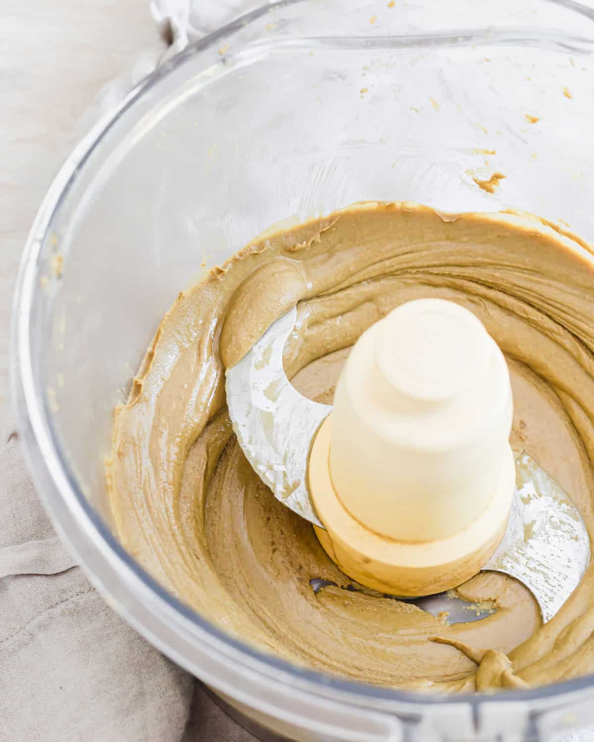 Creamy pumpkin seed butter in a food processor after 10 minutes.