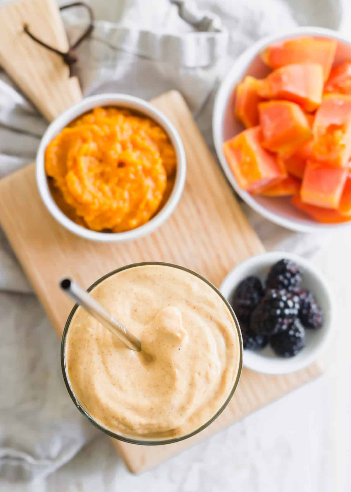 Nutrient-rich and digestive friendly papaya smoothie to help heal and promote good gut health.