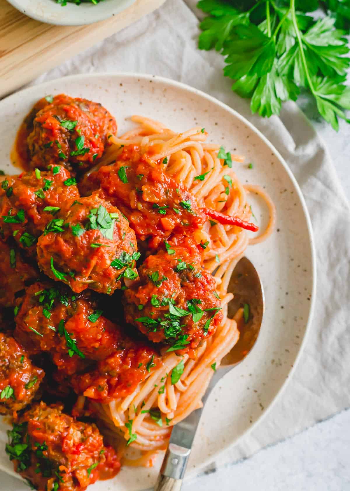 Venison meatballs with marinara sauce served with spaghetti.
