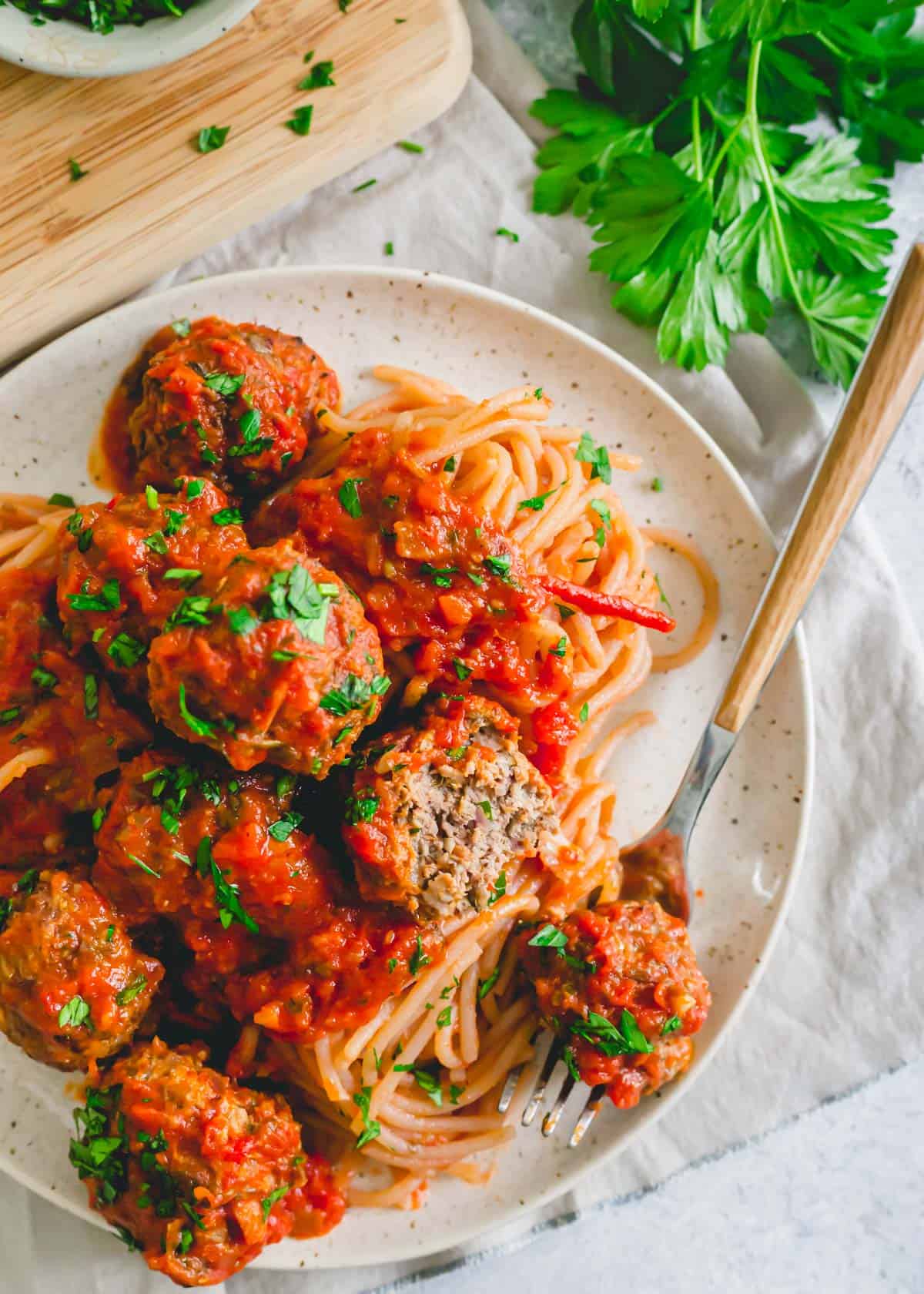 Spaghetti and venison meatballs on a plate.