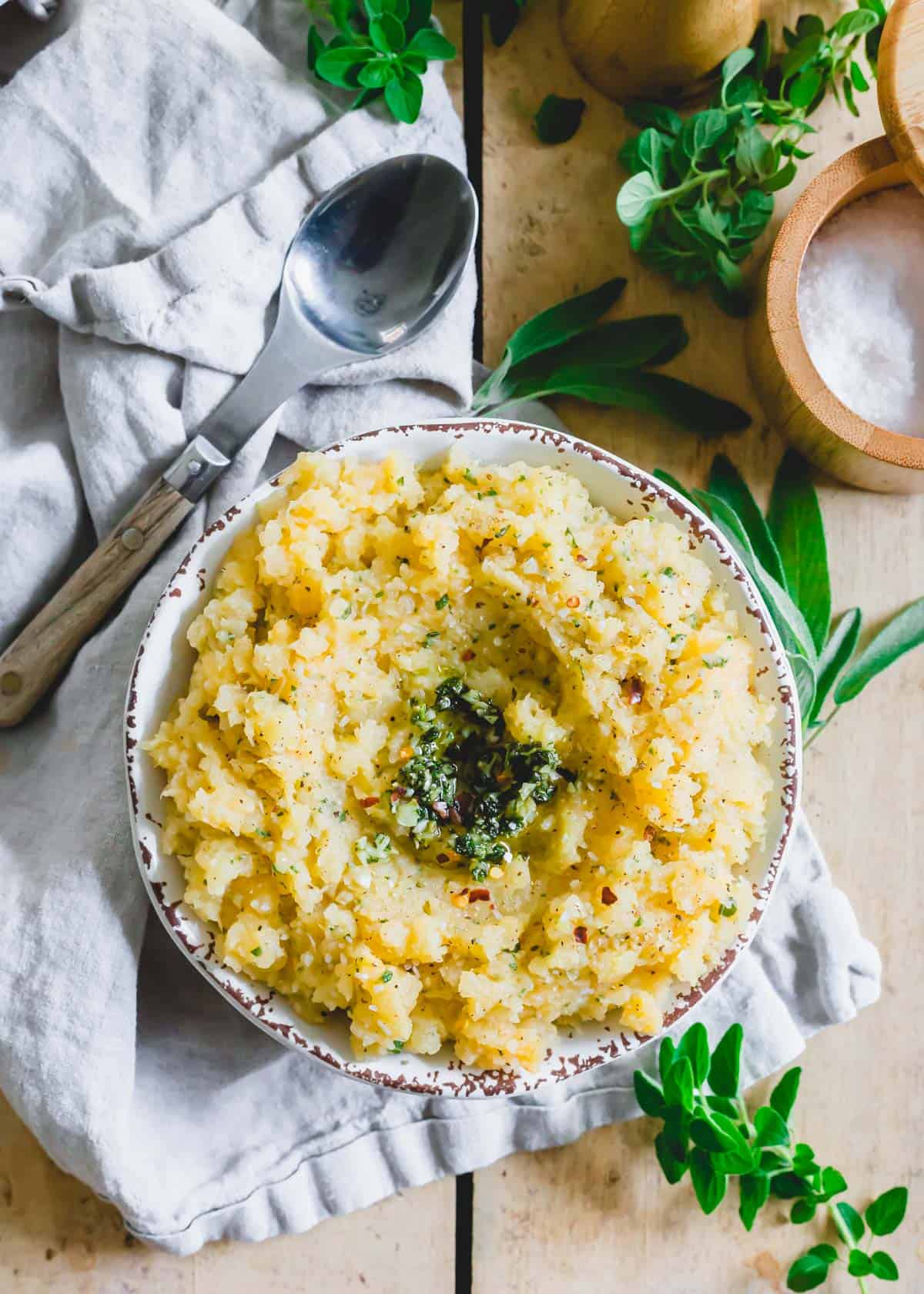 Mashed rutabaga with garlic herb butter in a serving bowl.