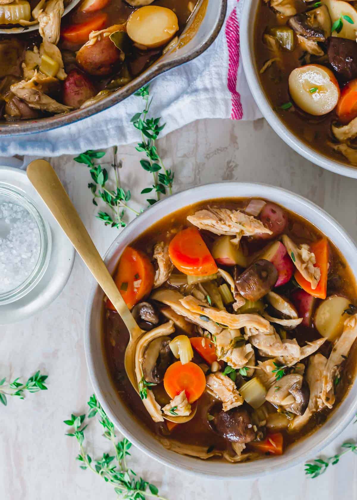 Thanksgiving leftover turkey stew in a bowl with a spoon.