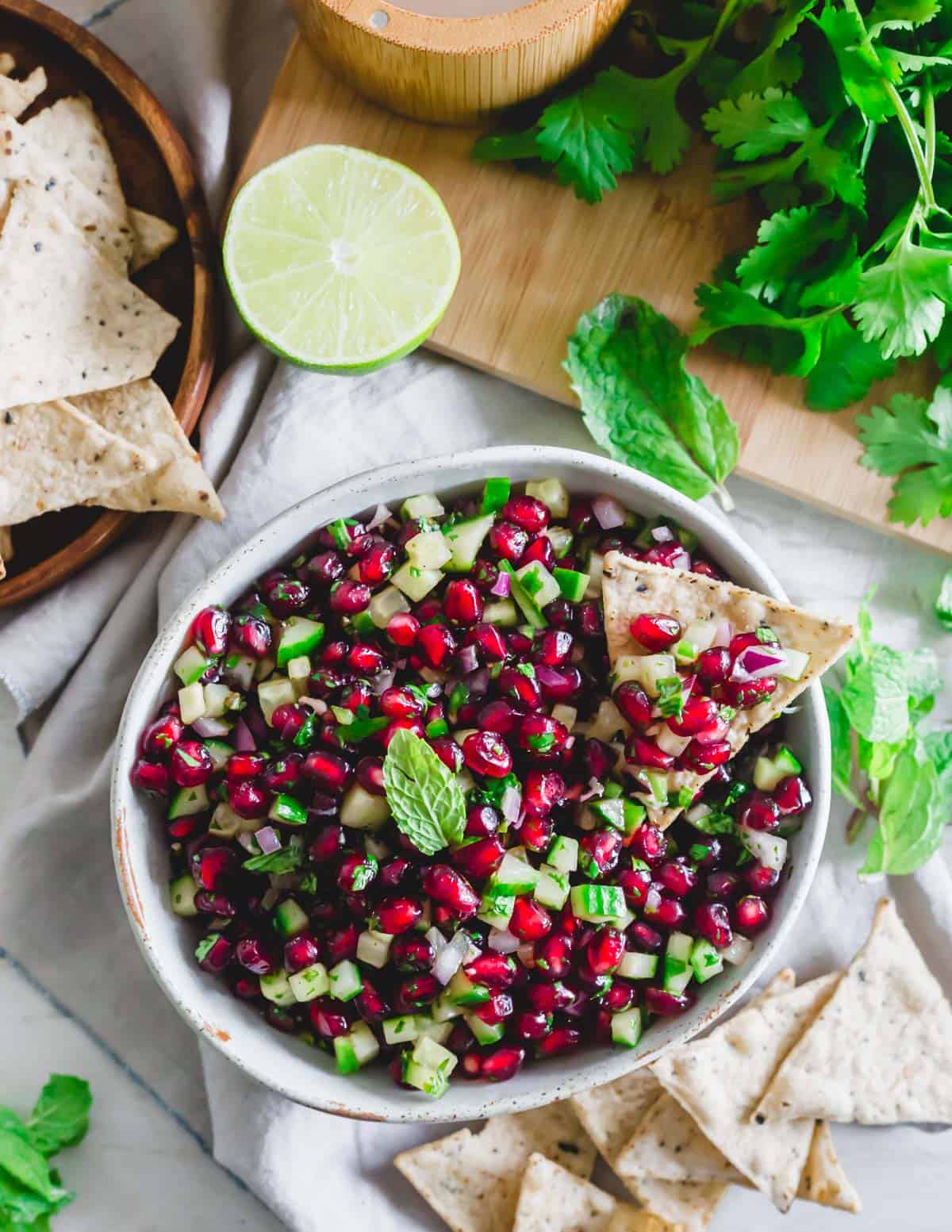 Fresh pomegranate salsa recipe served with tortilla chips.