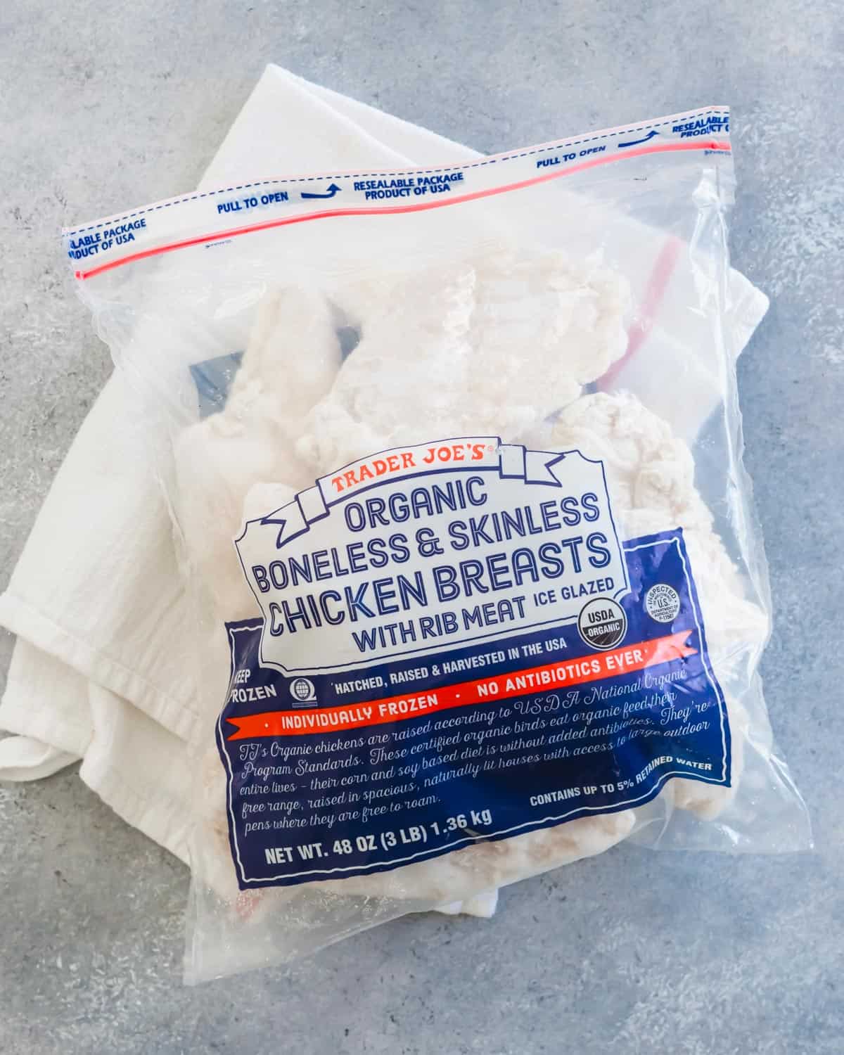 Package of organic frozen chicken breasts.