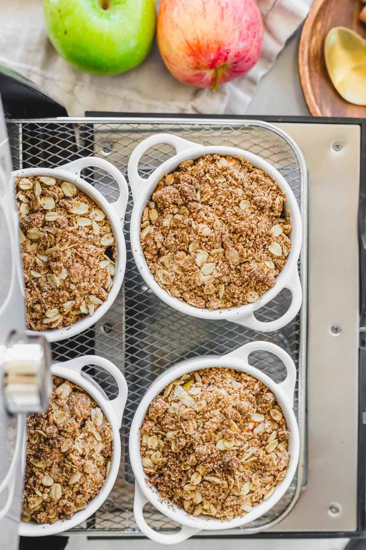 Apple crisp baked in the air fryer on the air fryer tray.