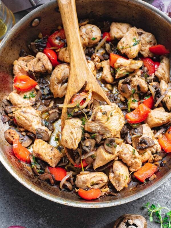 Chicken bites with garlic, mushrooms, red peppers and onion.