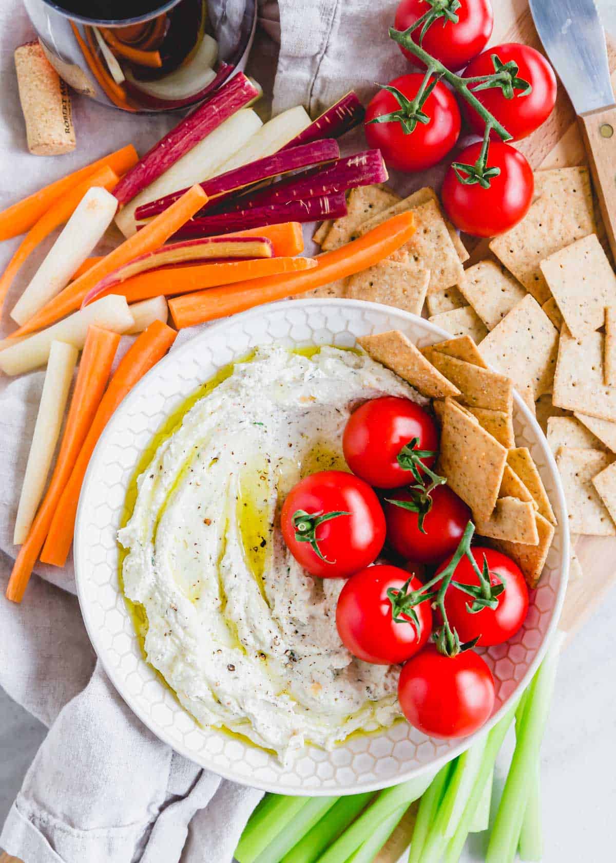 Whipped goat cheese drizzled with olive oil served with dipping vegetables. Whipped goat cheese drizzled with olive oil served with dipping vegetables.