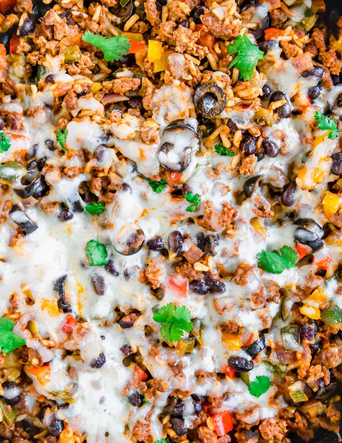 Melted cheese on top of a Mexican ground beef skillet.