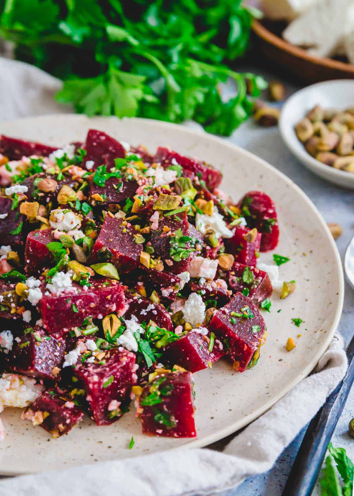Beet with feta salad served with pistachios and fresh herbs.