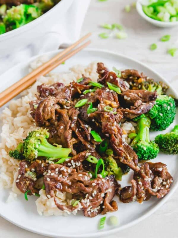 A plate of meat and broccoli.