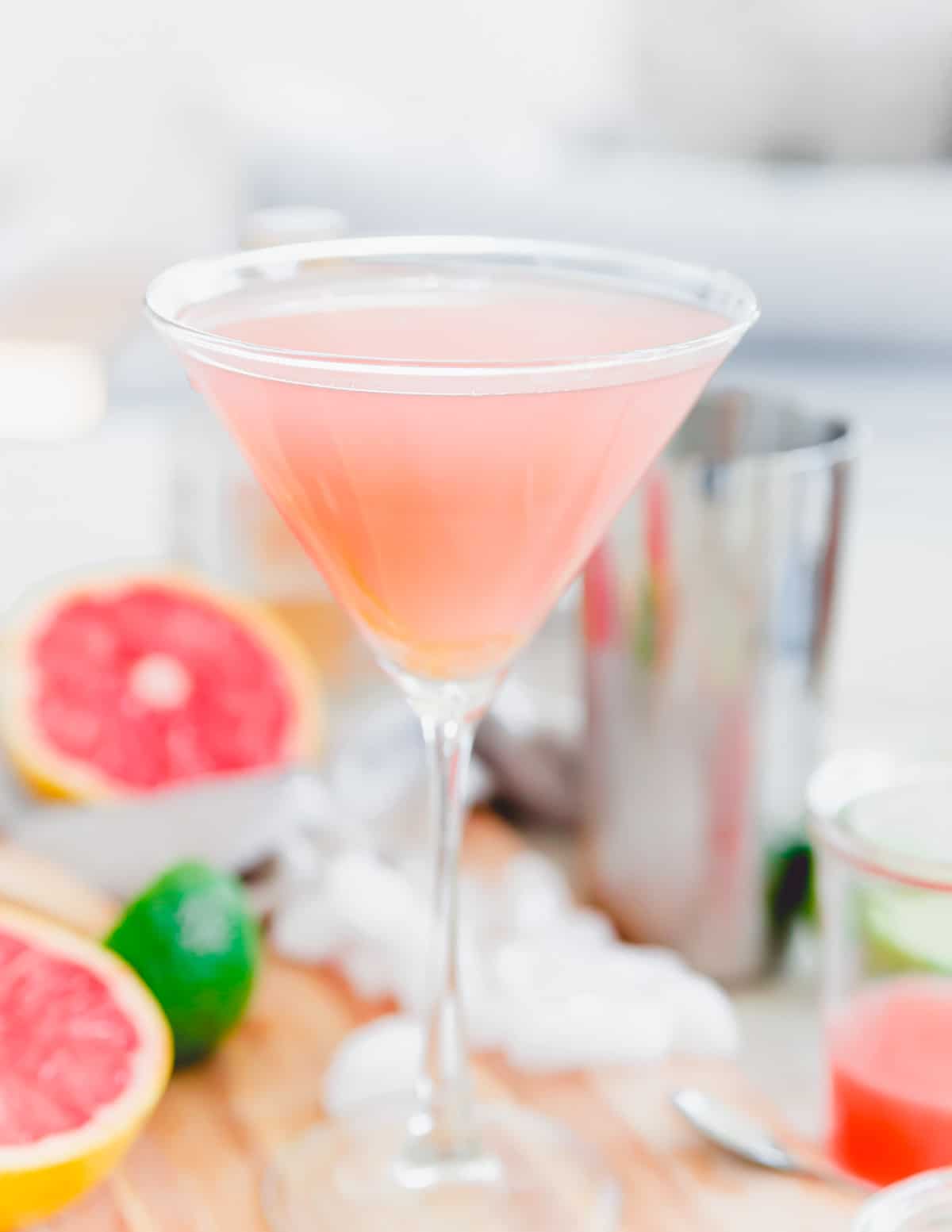 Grapefruit martini in a long stem martini glass.